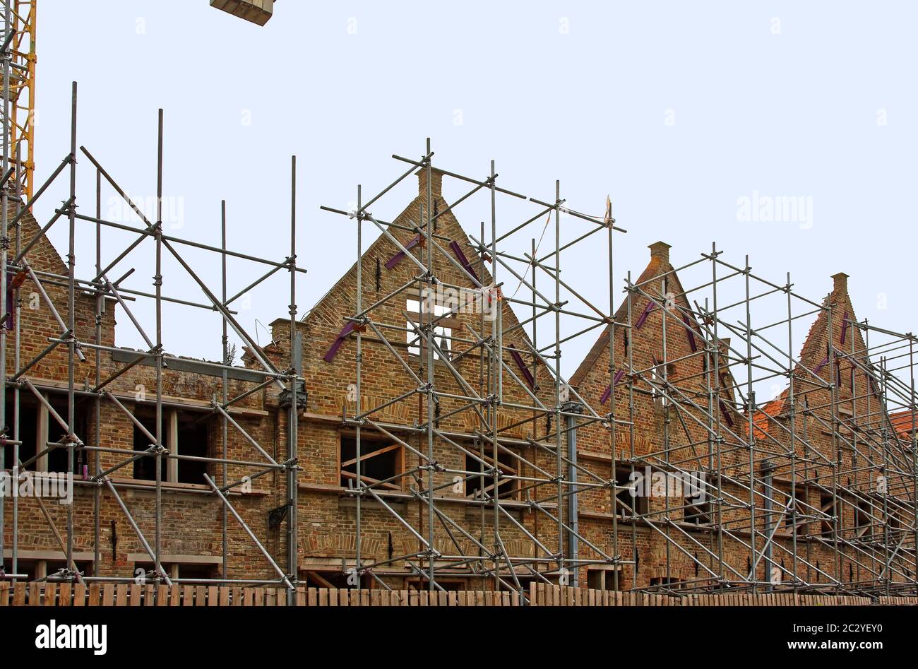 scaffolding, buildings, Flemish architecture, windows removed, major renovation, construction, medieval, old, Europe, Bruges; Brugge; Belgium, summer Stock Photo