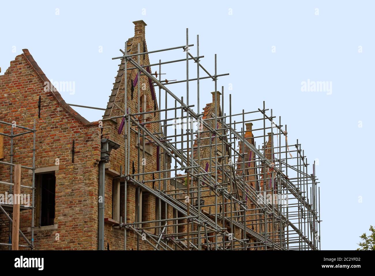 scaffolding, buildings, Flemish architecture, windows removed, major renovation, construction, medieval, old, Europe, Bruges; Brugge; Belgium, Europe, Stock Photo