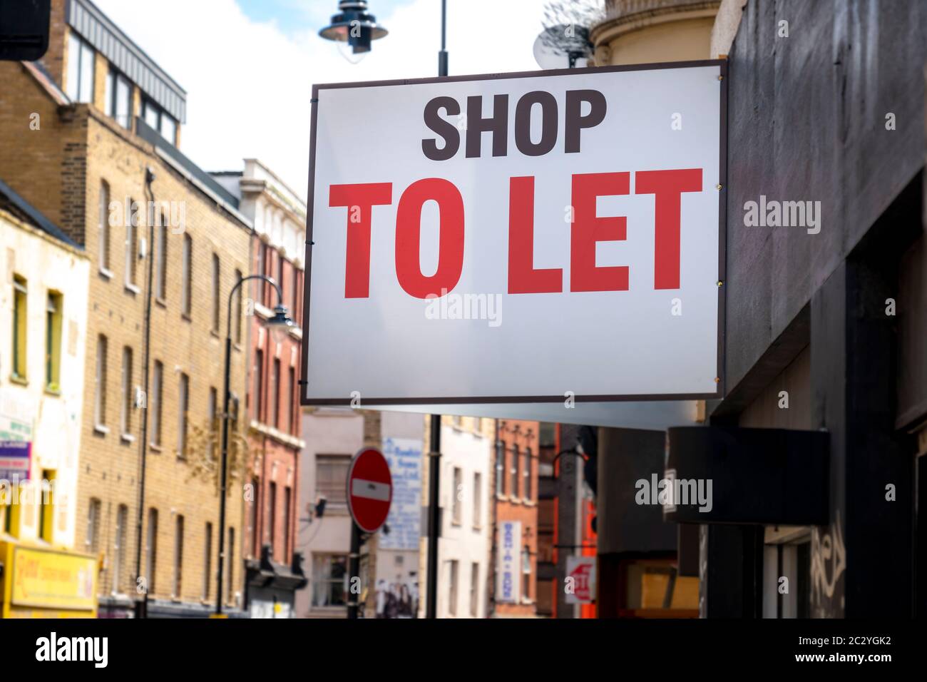 'Shop To Let' sign on city street Stock Photo