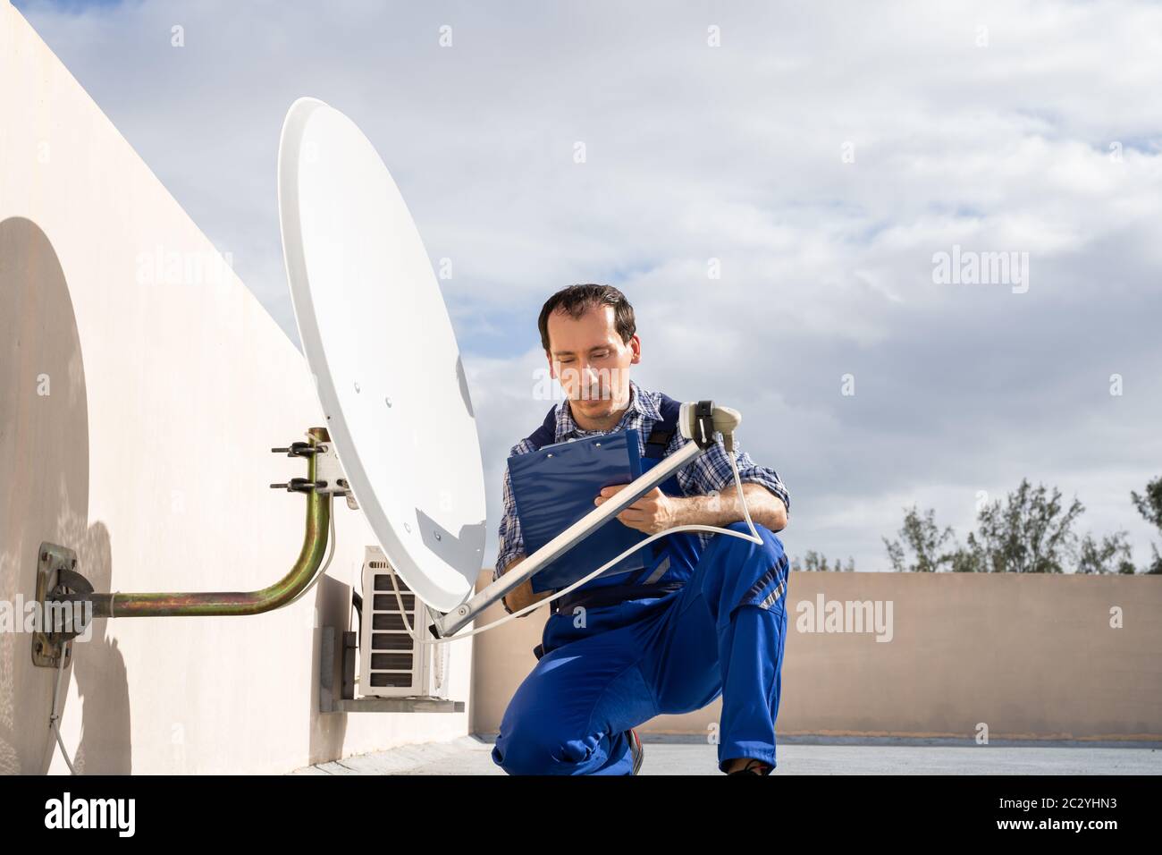 Installing satellite dish hires stock photography and images Alamy