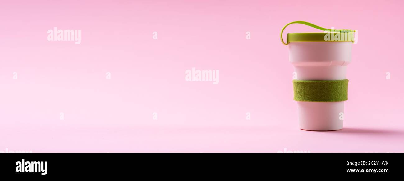 Photo Of Reusable Coffee Cup On Pink Background Stock Photo