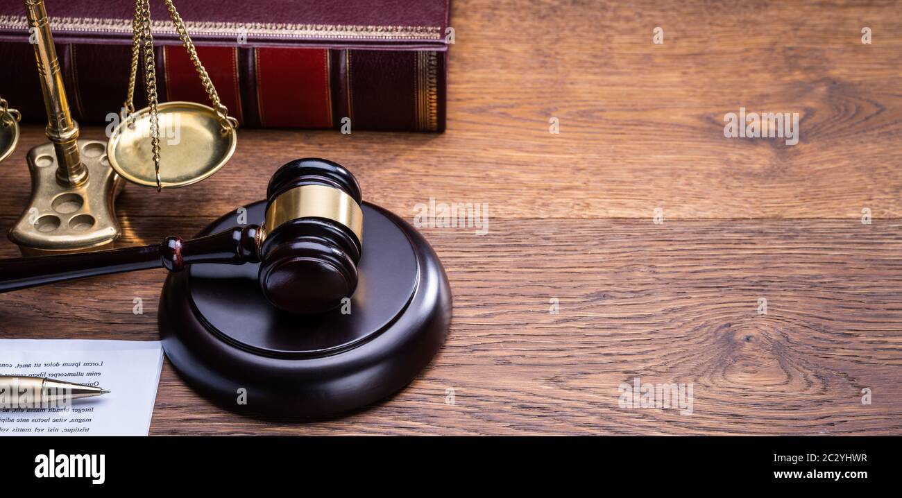 Wooden Gavel Golden Scale And Law Book On Table Stock Photo - Alamy