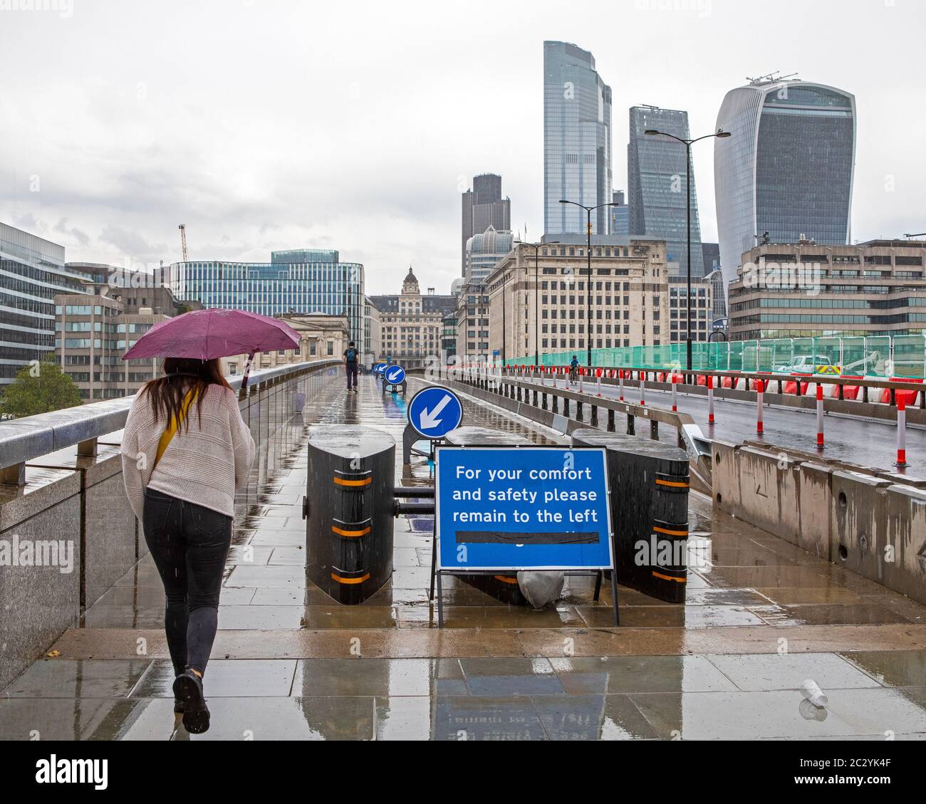 London, UK - June 17th 2020: Walking lanes on London Bridge to help ensure that people follow the social distancing measures during the Coronavirus pa Stock Photo