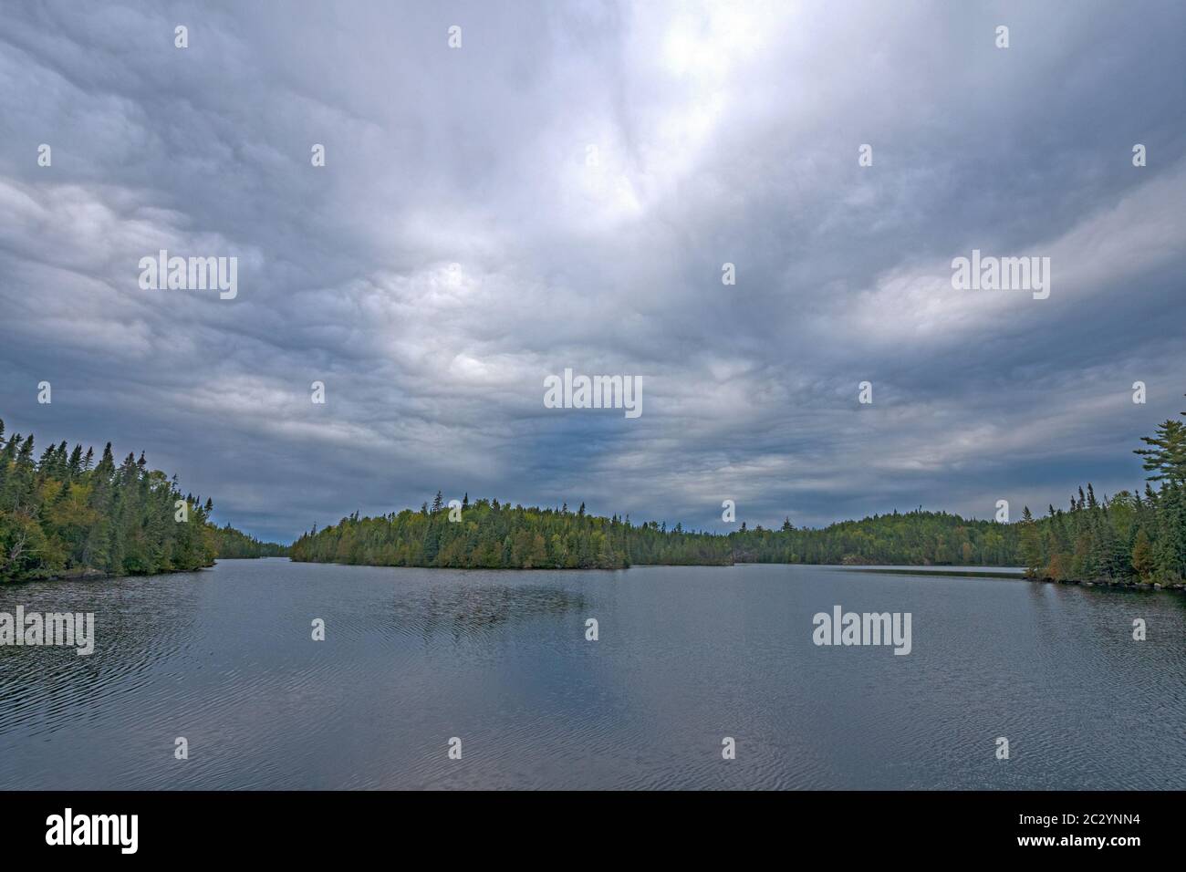 Storm Clouds Rolling Over the North Woods on Omega Lake in The Boundary Waters in Minnesota Stock Photo