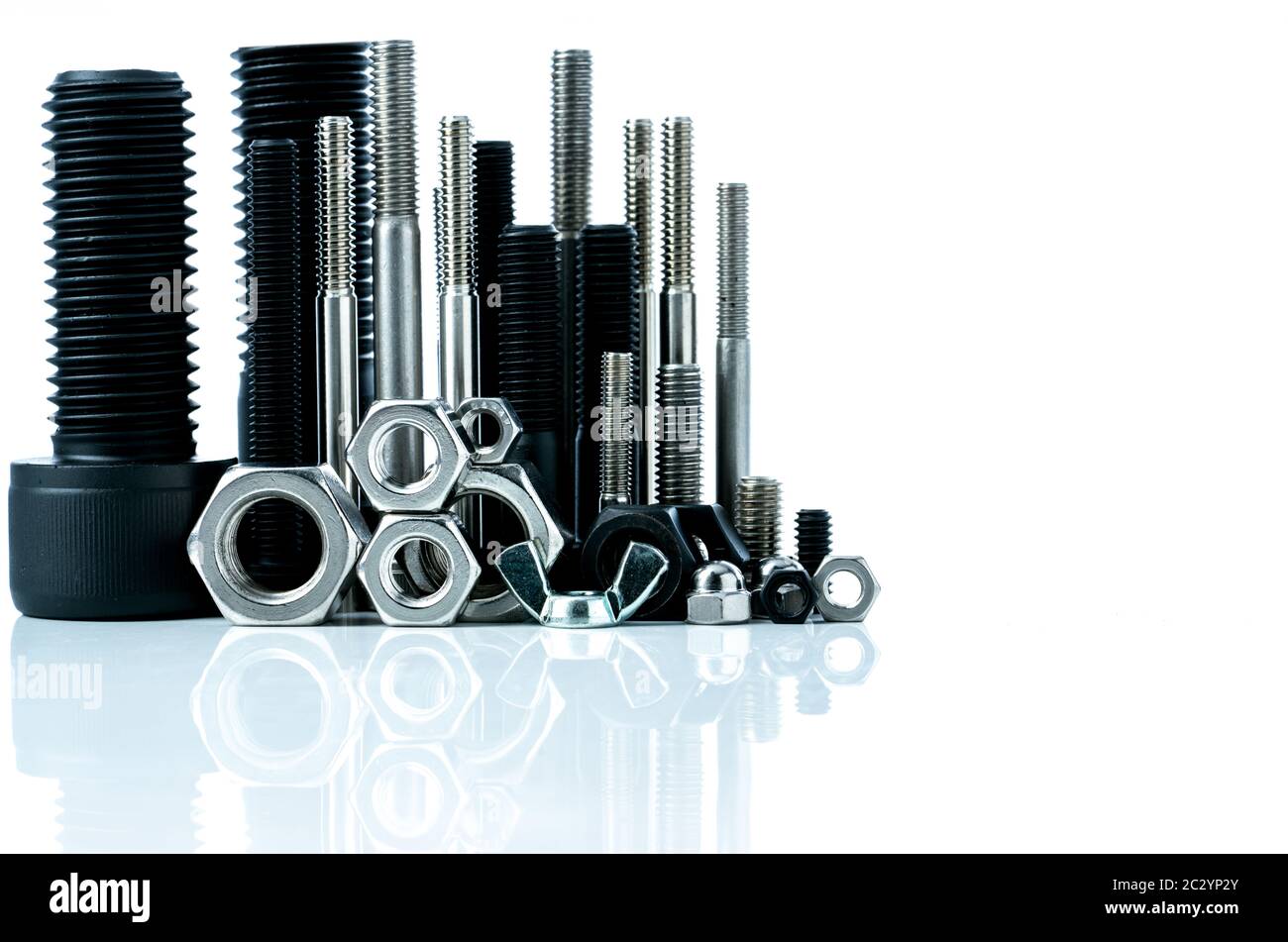 Metal bolts and nuts on white background. Fasteners equipment. Hardware