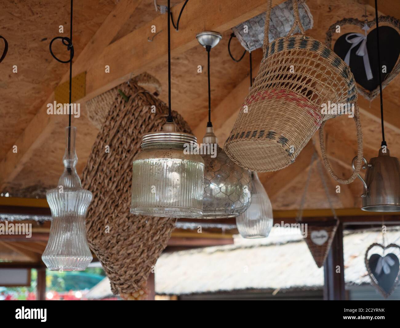 Decorative lamps and baskets hang on the ceiling Stock Photo Alamy