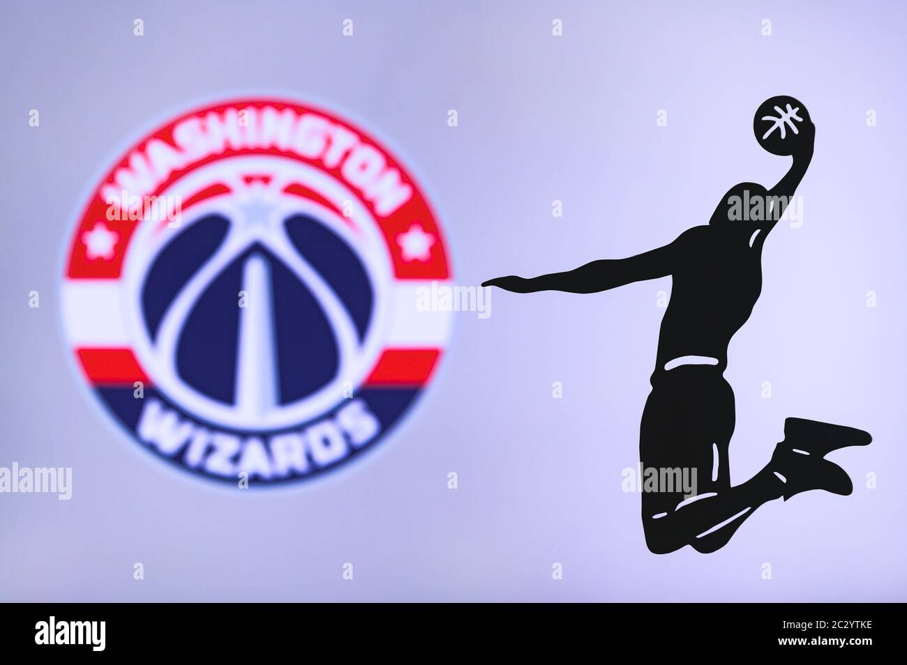 NEW YORK, USA, JUN 18, 2020: Washington Wizards basketball club logo, silhouette of jumping basket player, sport photo NBA, edit space. Stock Photo