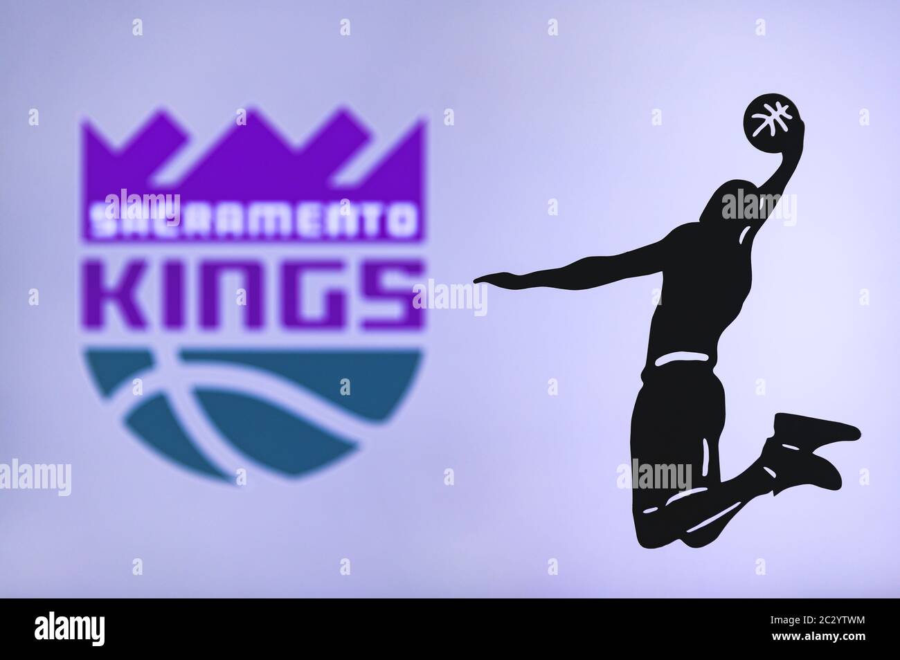 NEW YORK, USA, JUN 18, 2020: Sacramento Kings basketball club logo, silhouette of jumping basket player, sport photo NBA, edit space. Stock Photo
