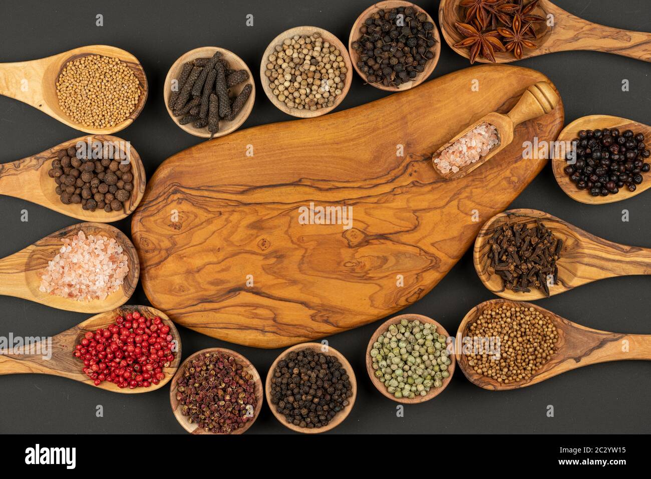 Six small wooden bowls, eight cooking spoons made of olive wood filled
