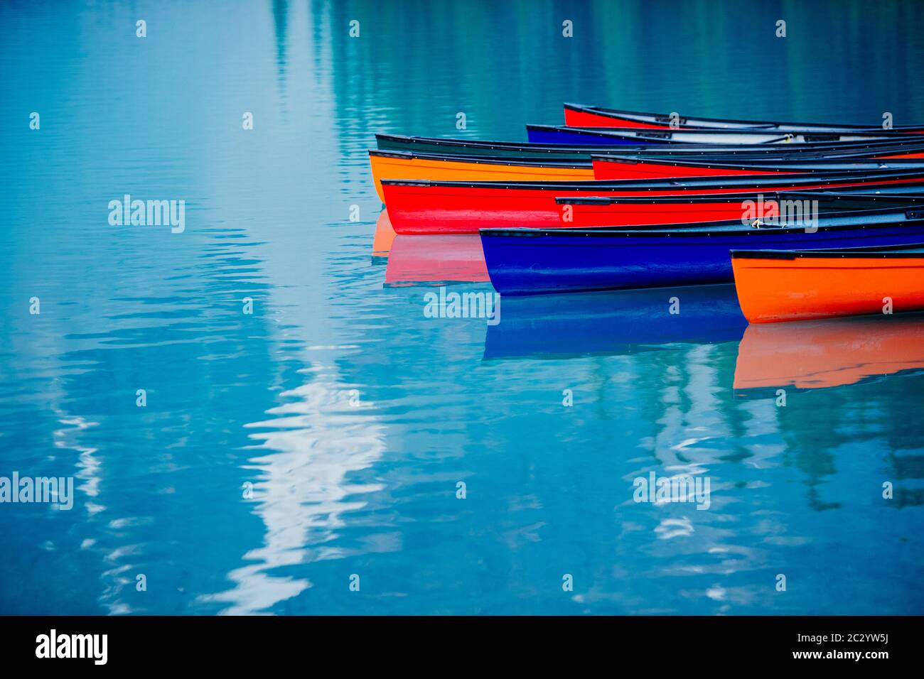 Colorful rowboats reflection, Banff, Alberta, Canada Stock Photo