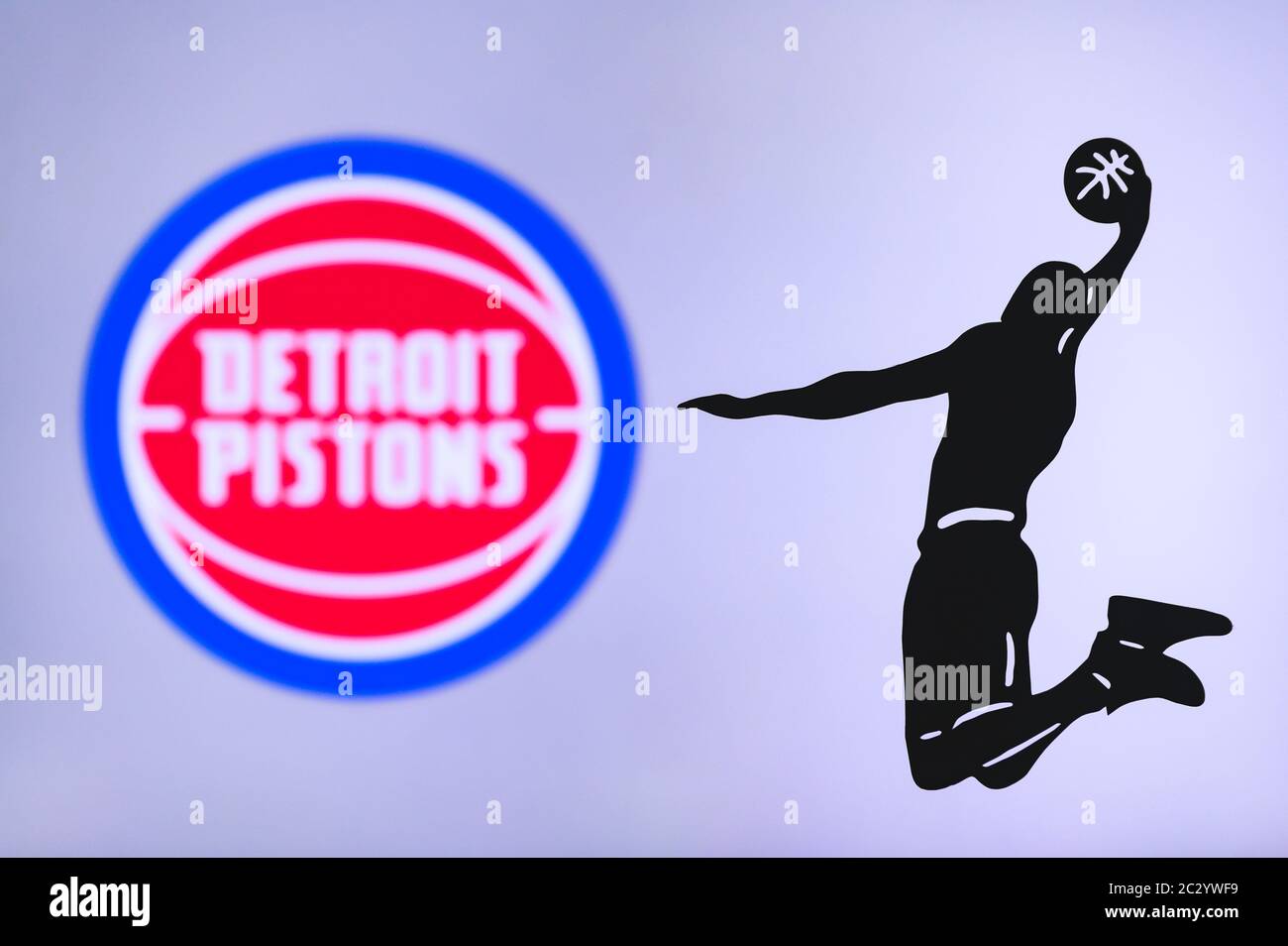 NEW YORK, USA, JUN 18, 2020: Detroit Pistons basketball club logo, silhouette of jumping basket player, sport photo NBA, edit space. Stock Photo