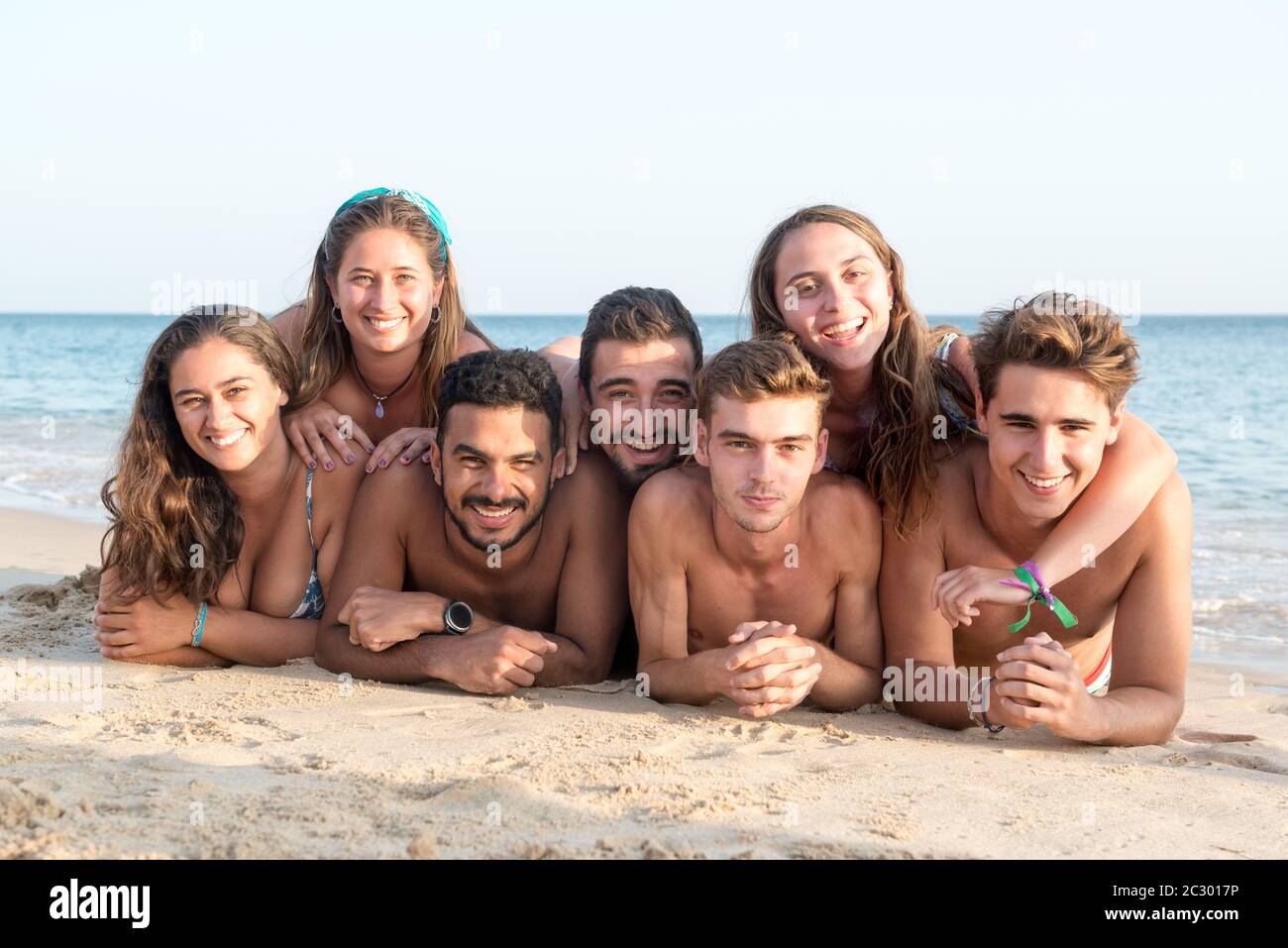 Large Group Of Young People Enjoying A Beach Party Stock Photo, Picture and  Royalty Free Image. Image 21131228.