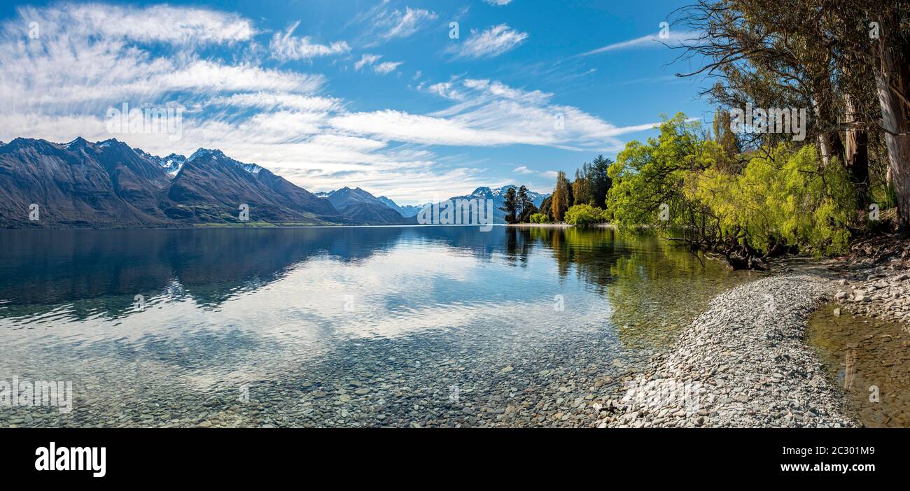 Mountains reflected in the lake, Lake Wakatipu, Otago, South Island, New Zealand Stock Photo