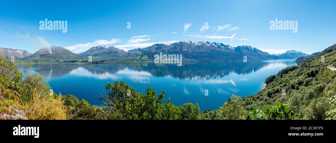 Mountains reflected in the lake, Lake Wakatipu, Otago, South Island, New Zealand Stock Photo