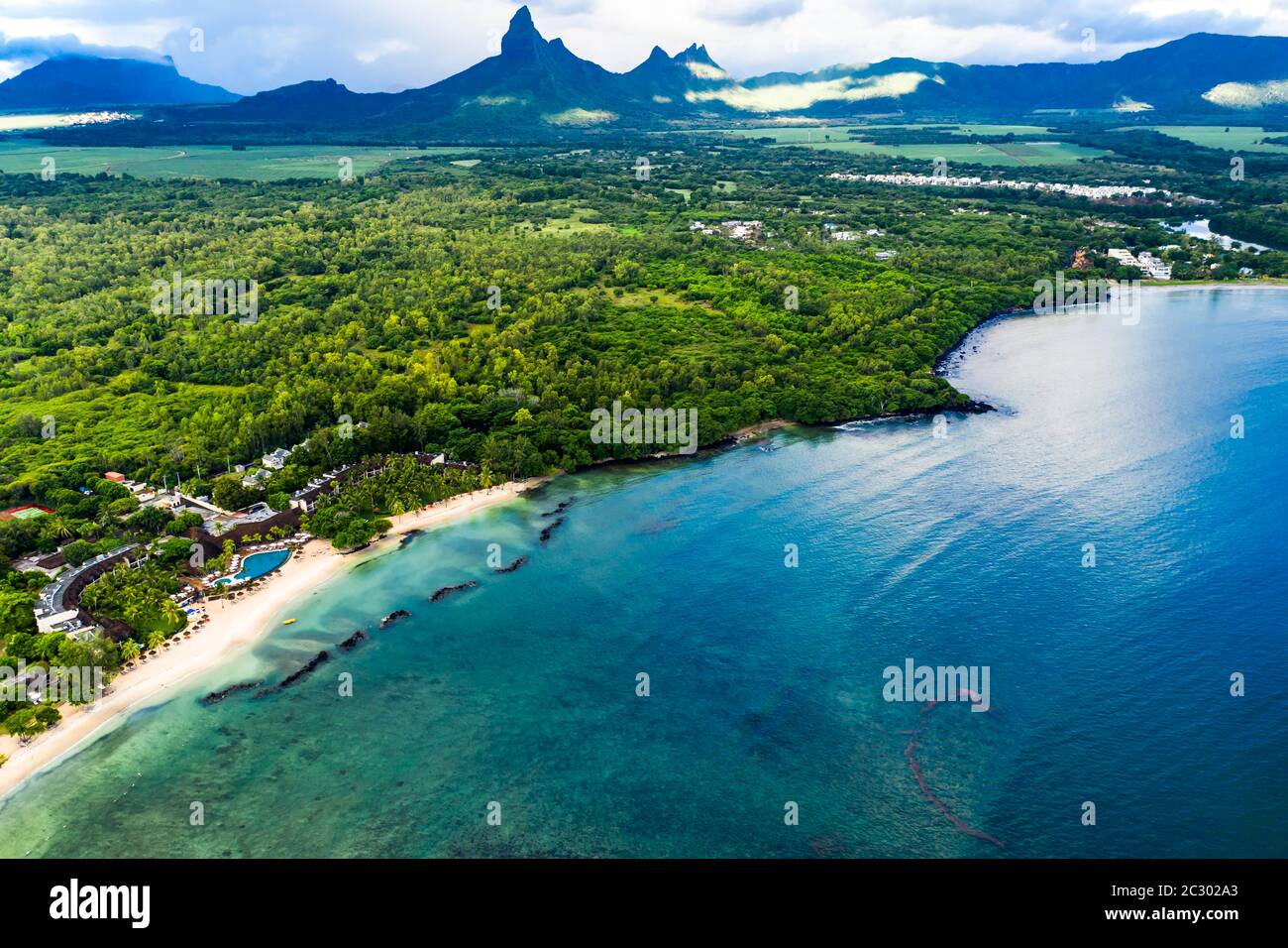 Aerial view, the beach of Flic en Flac with luxury hotels and palm trees, in the back the mountain Trois Mamelles, Mauritius, Africa Stock Photo