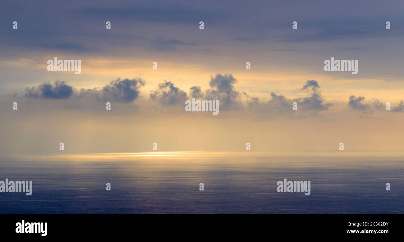 Moody sky at sunset above Pacific Ocean in South Kona, Hawaii Islands, USA Stock Photo