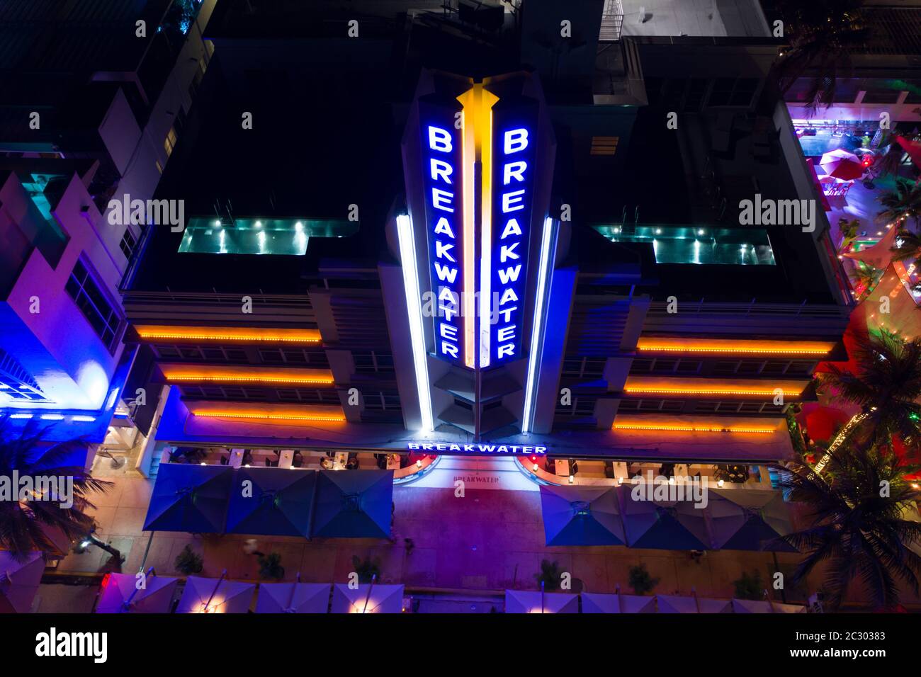 Aerial night photo Breakwater hotel Miami Beach neon retro blue lights Stock Photo