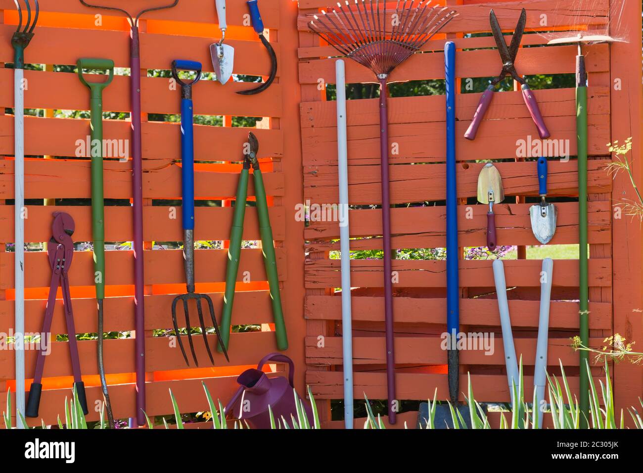 Various garden tools hanging on wooden wall Shovels, rakes, pruning shears,  Canada Stock Photo - Alamy