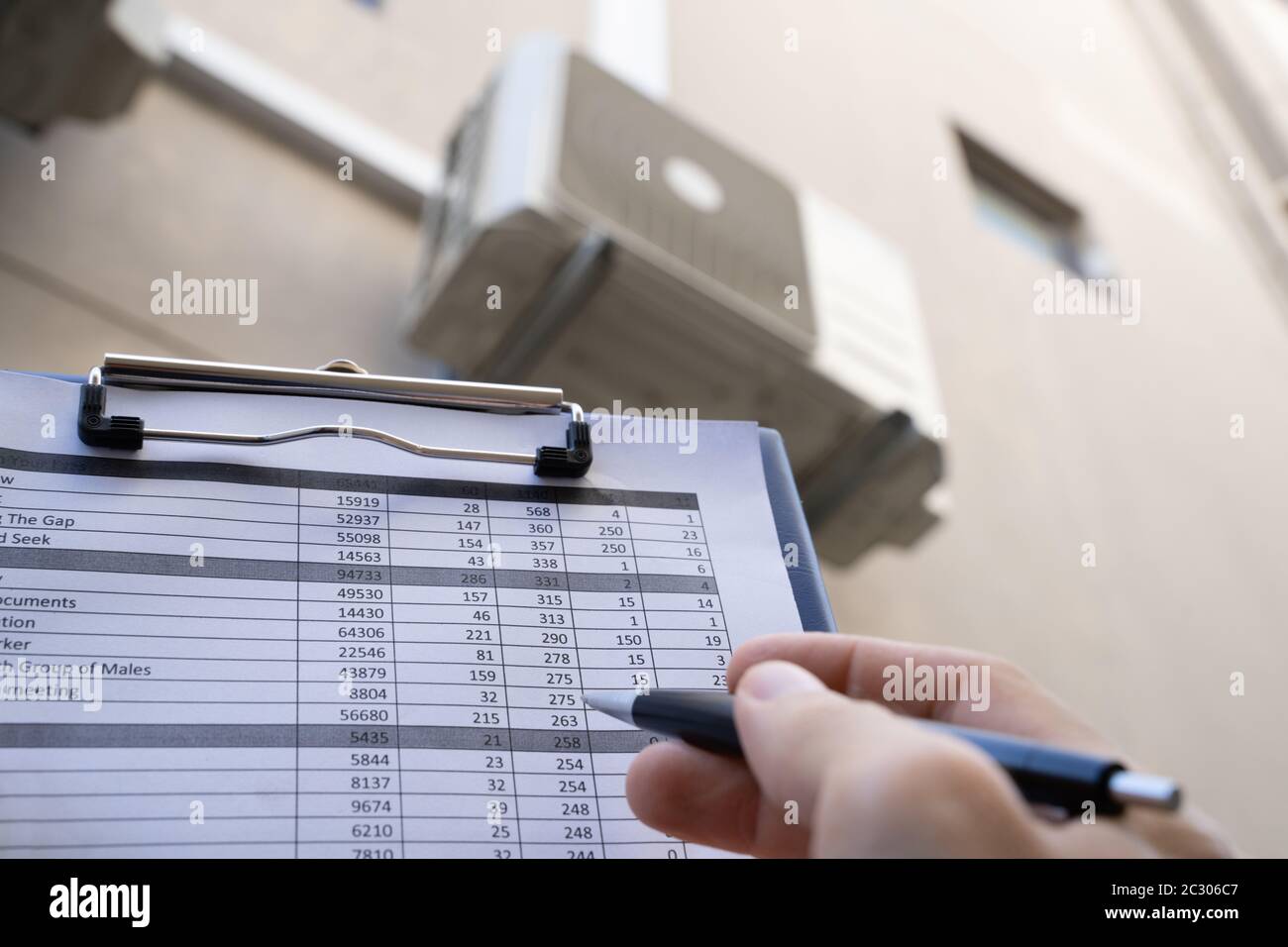 Man Doing Heating, Ventilation, And Air Conditioning Inspection Stock Photo