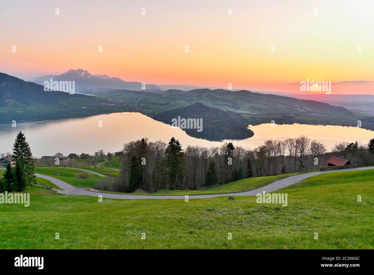 Evening mood at Lake Zug with gills of the narrowest part of the lake, behind Pilatus, Walchwil, Canton Zug, Switzerland Stock Photo