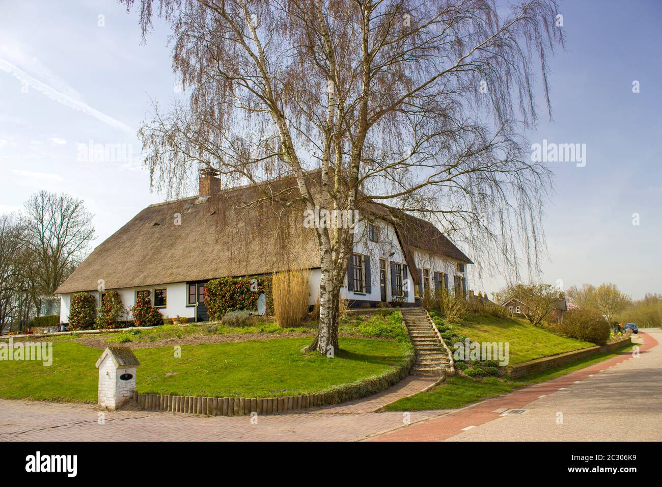 Typical dutch house with straw roof, with green garden. Country house, Gelderland, Netherlands Stock Photo