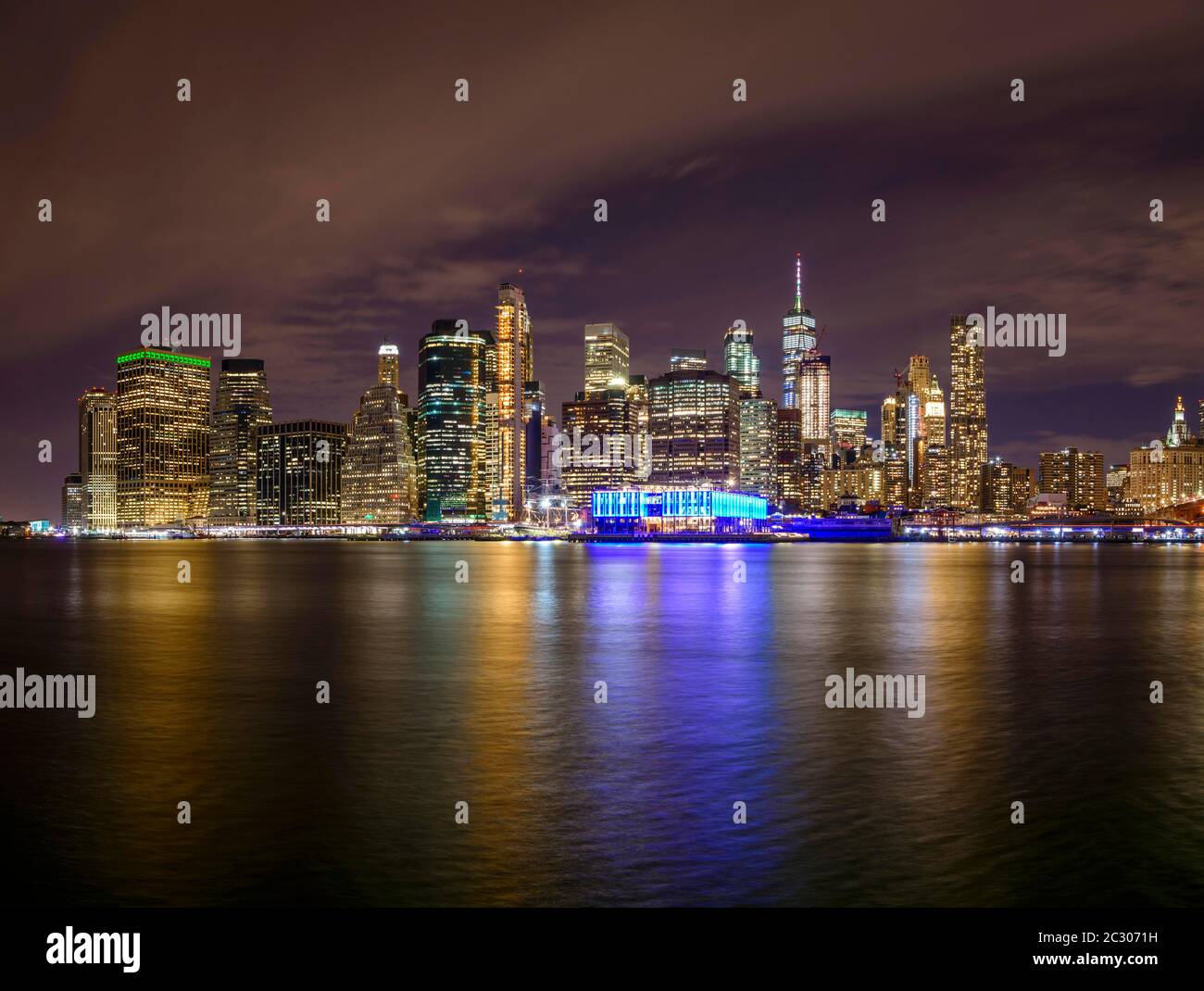 View from Pier 1 at night over the East River to the skyline of lower