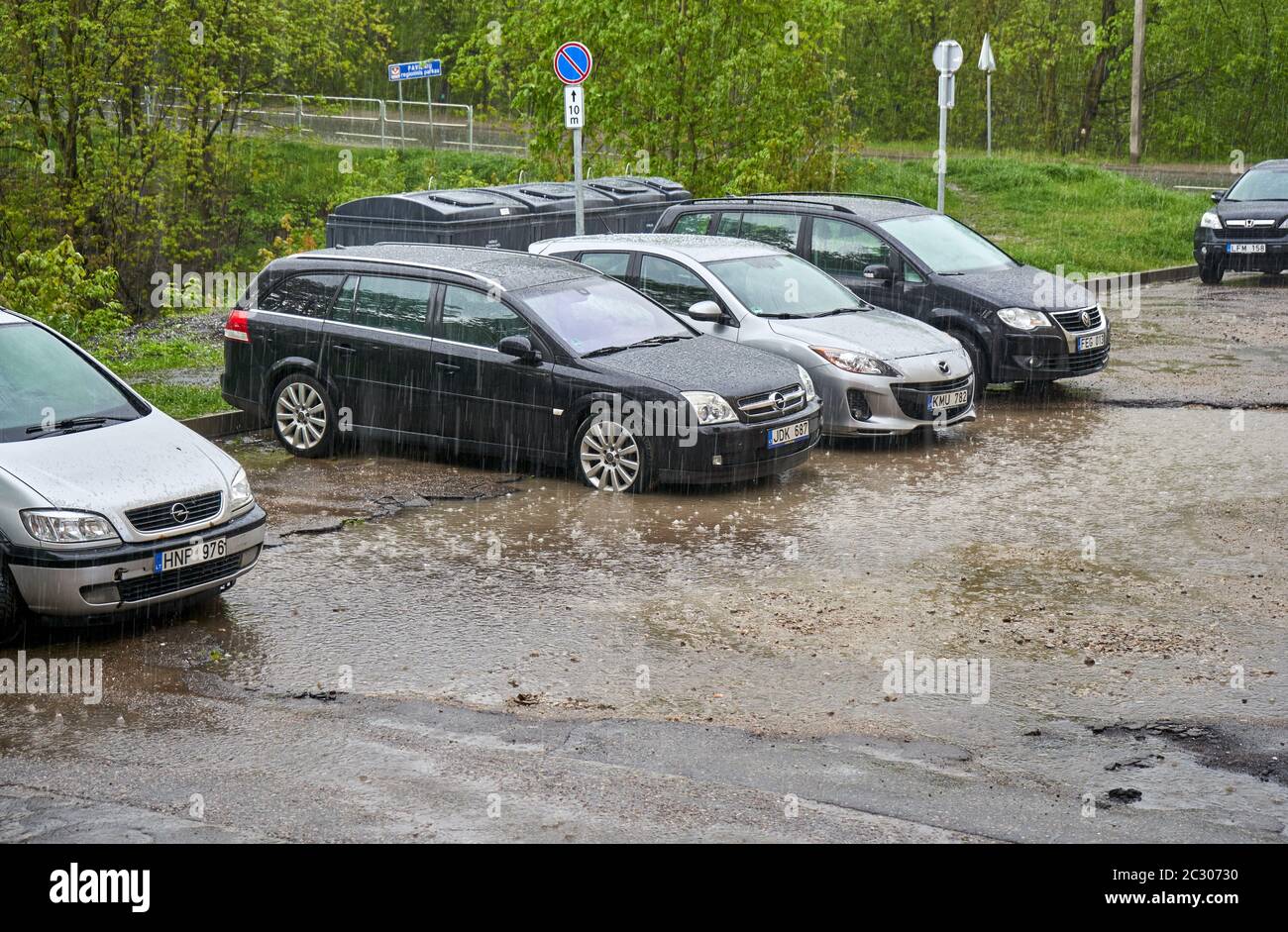 Heavy rain in old parking lot Stock Photo