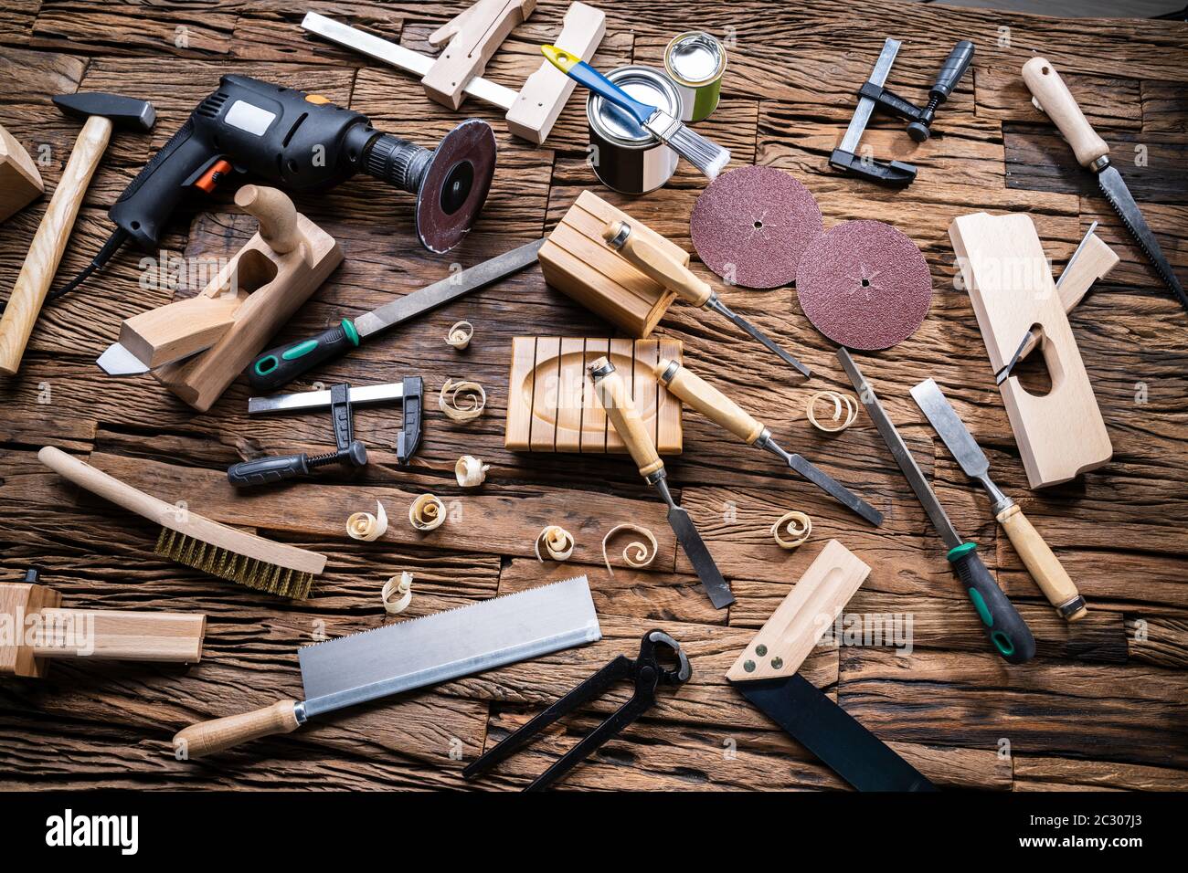 Various Carpenter Tools From Toolkit Laying On Desk Stock Photo