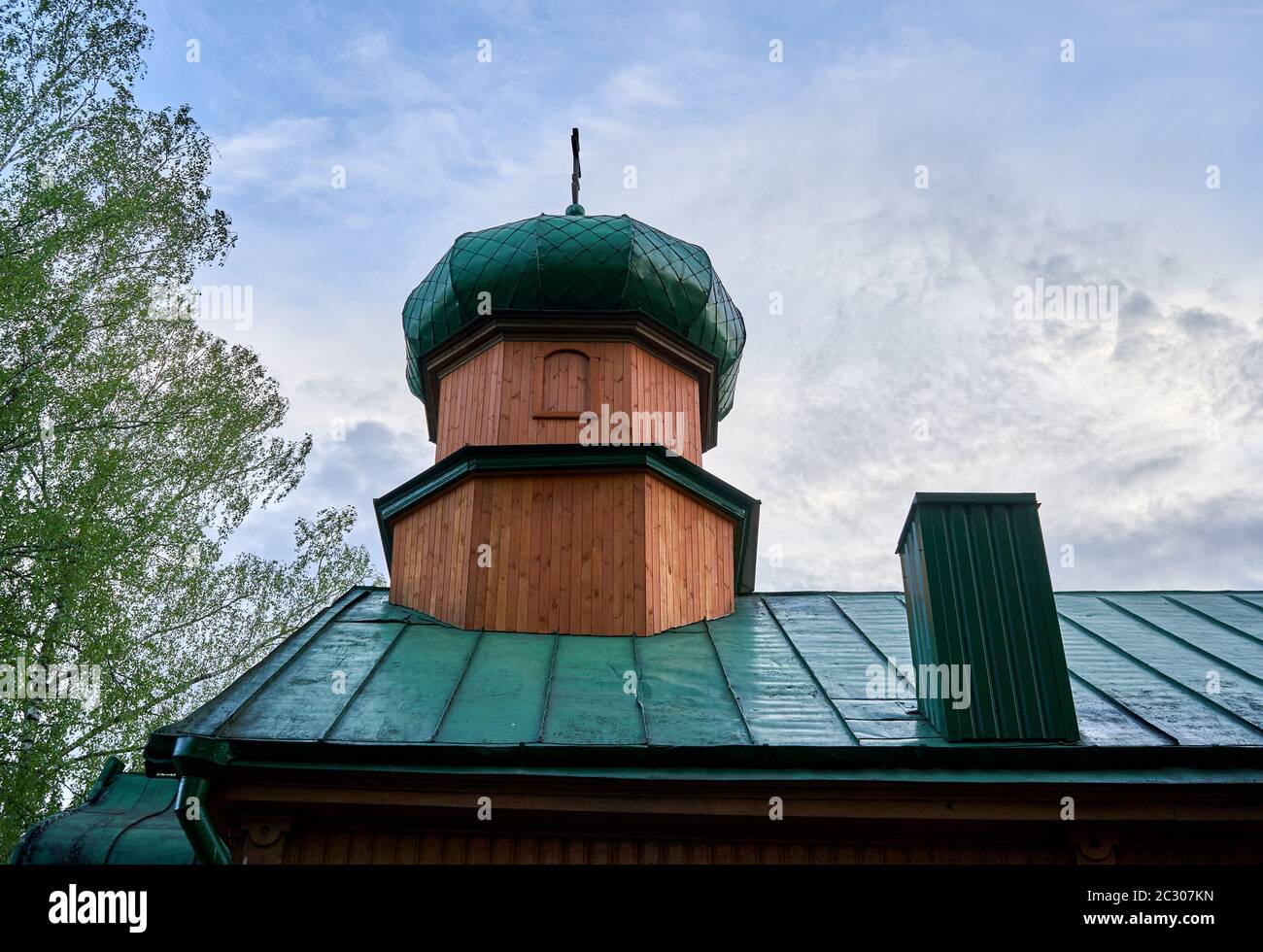 Wooden orthodox church tower with green roof Stock Photo