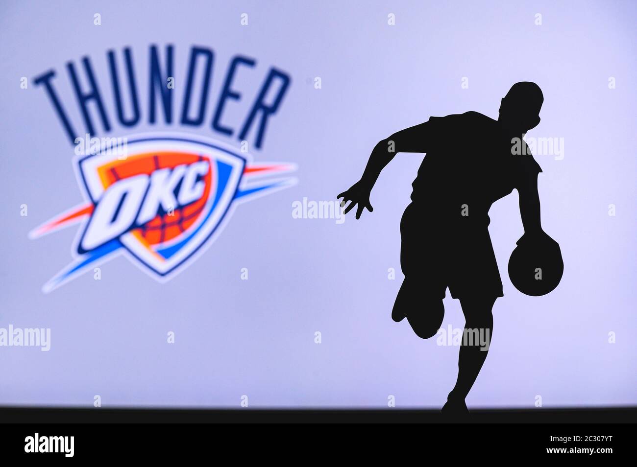 NEW YORK, USA, JUN 18, 2020 Oklahoma City Thunder basketball club logo and silhouette of young