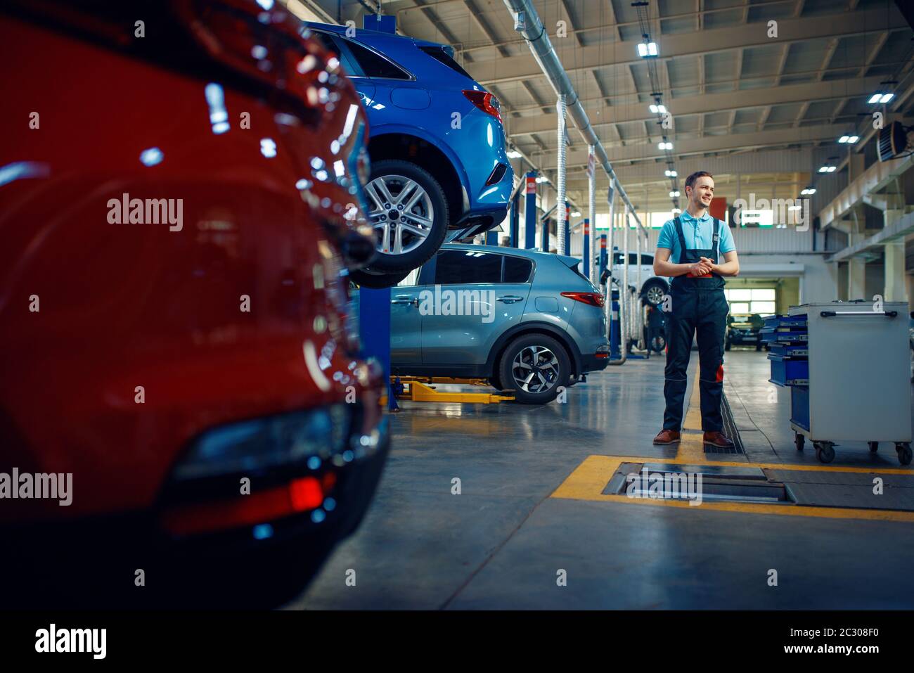 Man lifts car hi-res stock photography and images - Alamy
