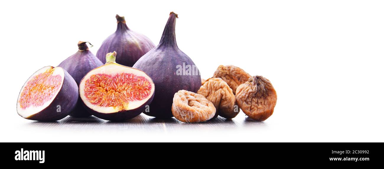 Composition with fresh and dried figs isolated on white. Stock Photo