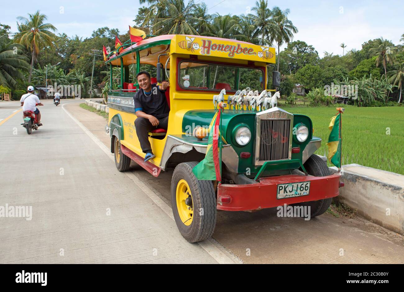 Jeepney Bus with driver, Siquijor Island, Central Visayas, Philippines Stock Photo