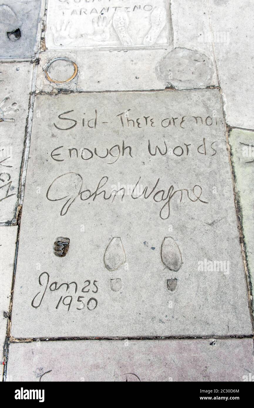 Film star, footprints of John Wayne, Grauman's Chinese Theatre, Hollywood, Los Angeles, California, USA Stock Photo