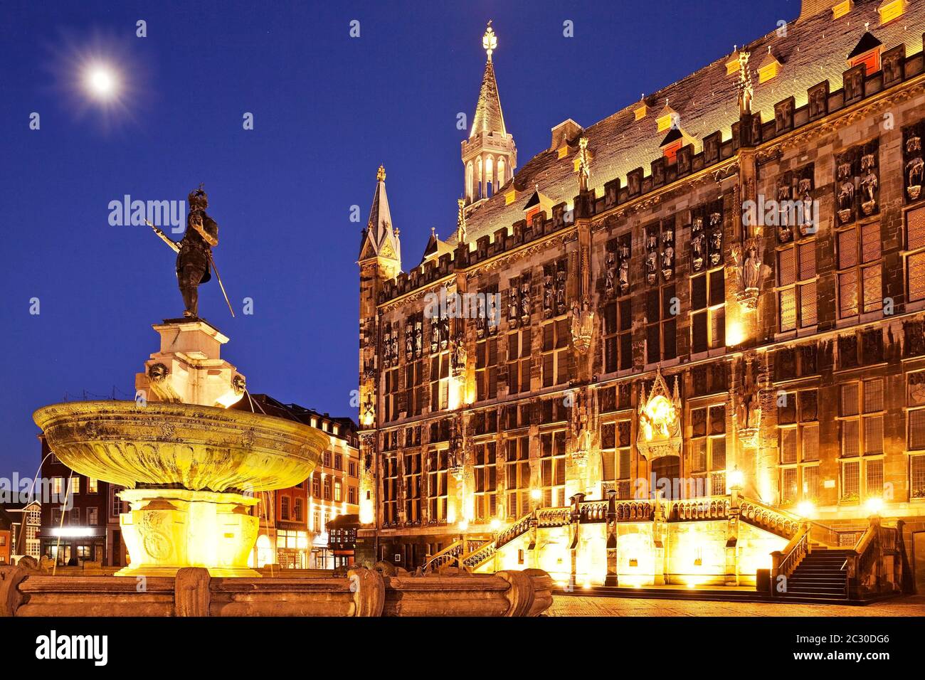 Karlsbrunnen in front of the city hall in the evening with full moon, Old Town, Aachen, North Rhine-Westphalia, Germany Stock Photo