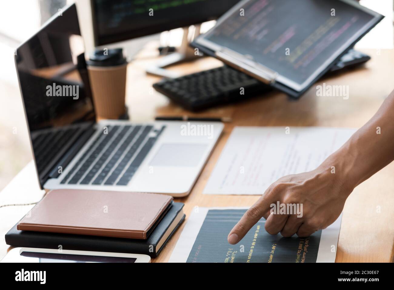 Asian team Outsource Developer Looking Screen Programming Code Working with Laptop Computer Software Stock Photo