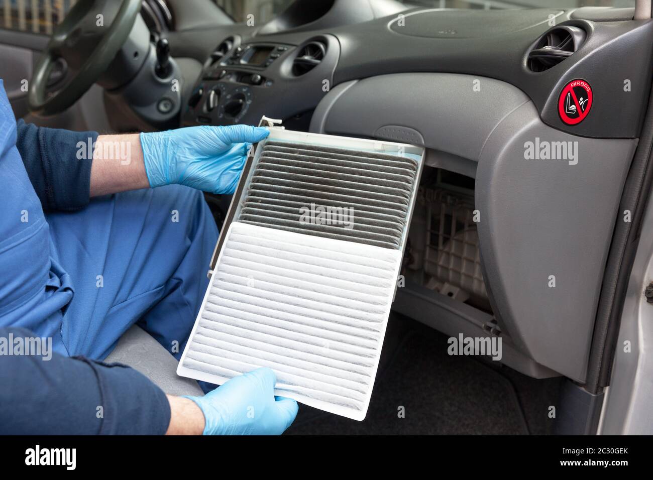 Replacing an old car cabin air filter Stock Photo Alamy