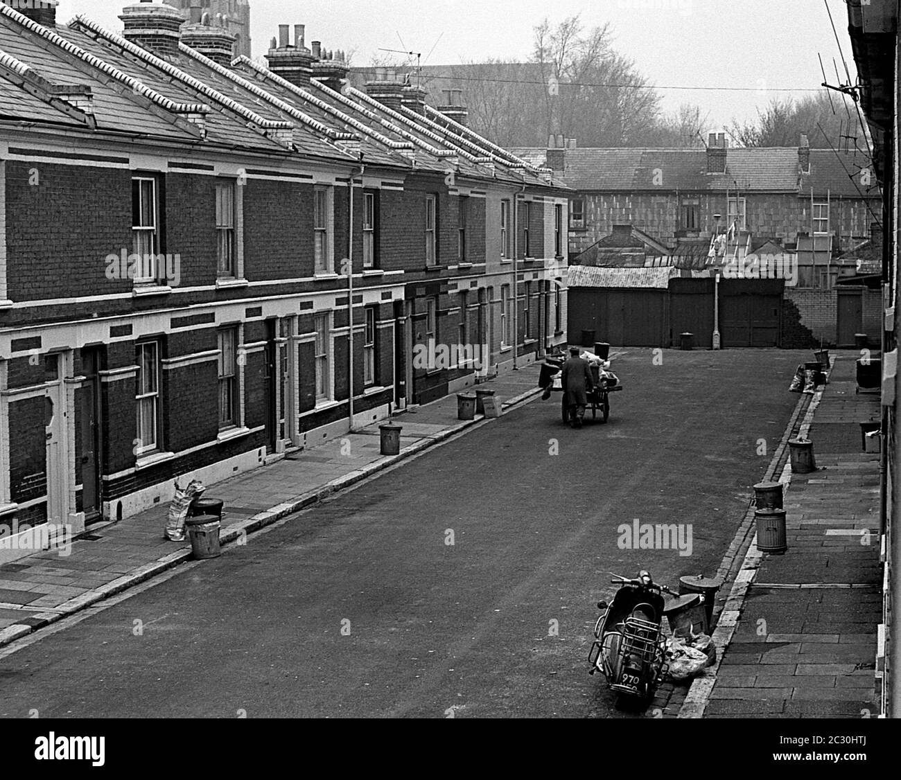 AJAXNETPHOTO. 20TH FBRUARY, 1968. PORTSMOUTH, ENGLAND. - FRATTON STREETS - A RAG N BONE MAN PUSHES HIS CART ALONG CARLESS ETHEL ROAD, A CUL-DE-SAC OFF CLIVE ROAD.PHOTO:JONATHAN EASTLAND/AJAX REF:3568133 0 23A Stock Photo