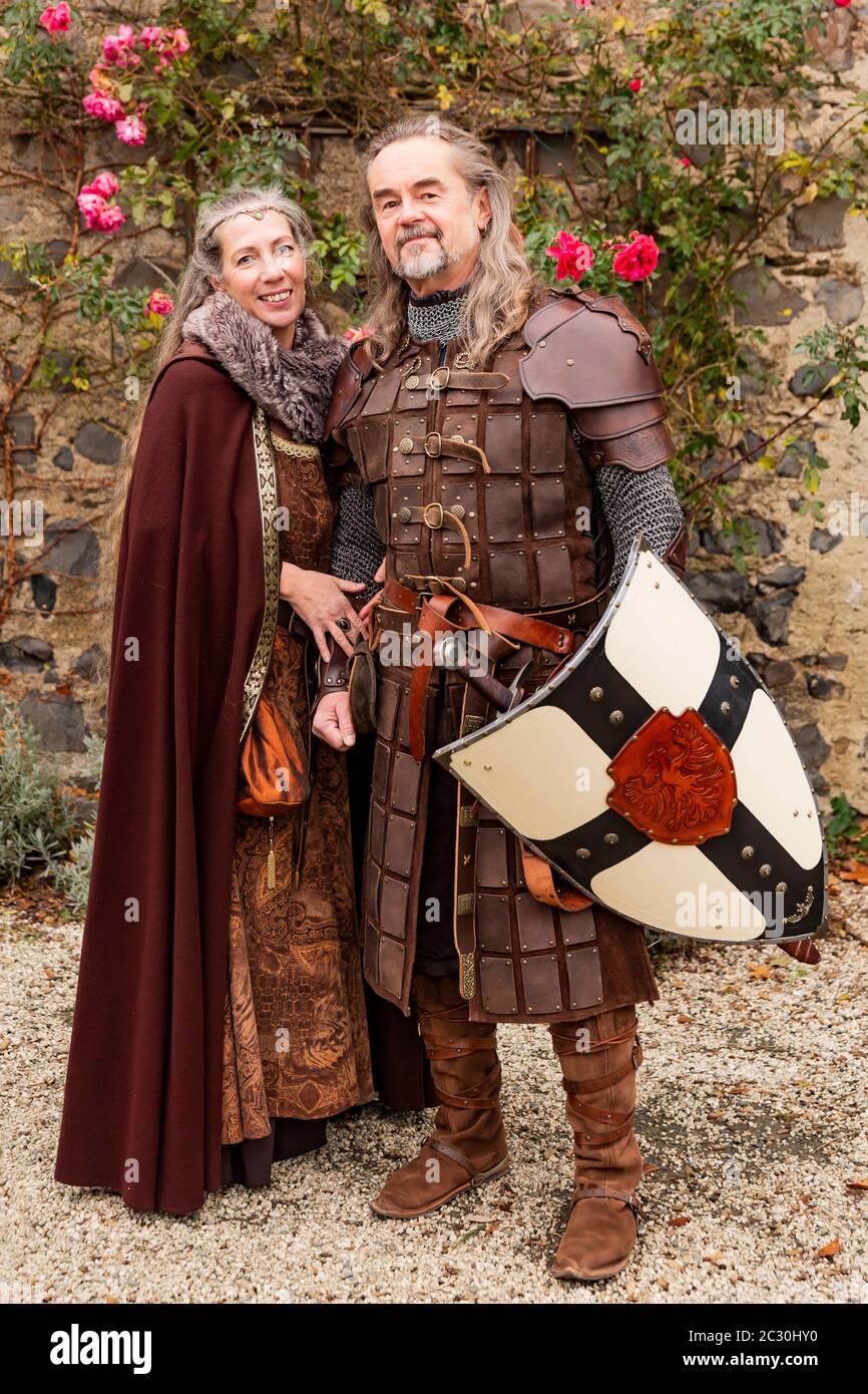 Couple posing robed in beautiful medieval clothing Stock Photo