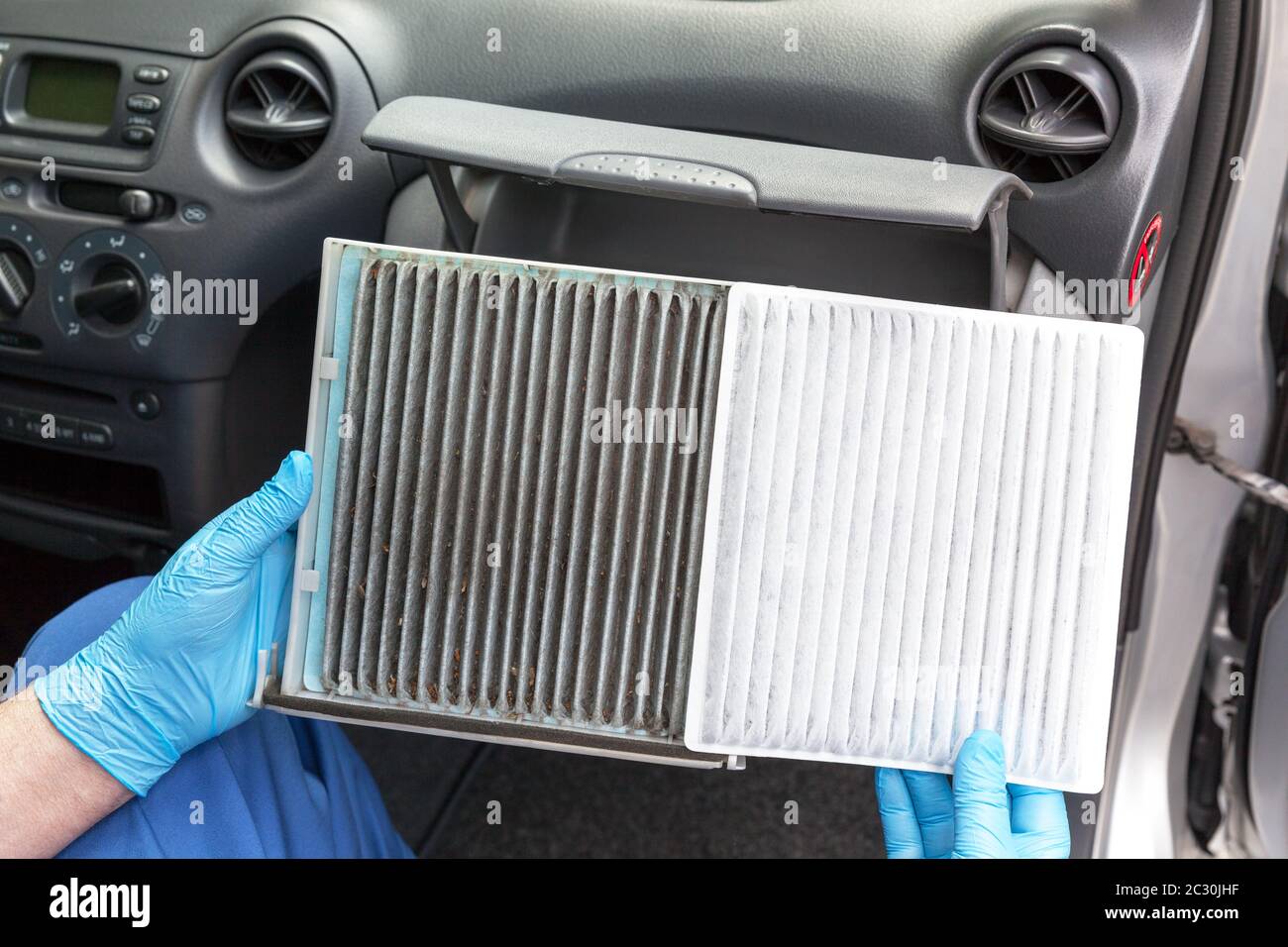 Replacing an old car cabin air filter Stock Photo Alamy