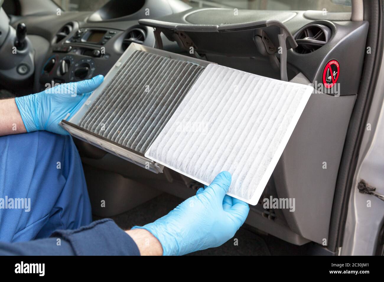 Replacing an old car cabin air filter Stock Photo Alamy