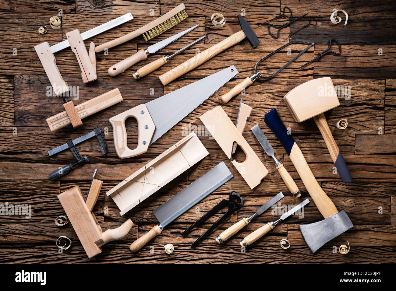 Various Carpenter Tools From Toolkit Laying On Desk Stock Photo