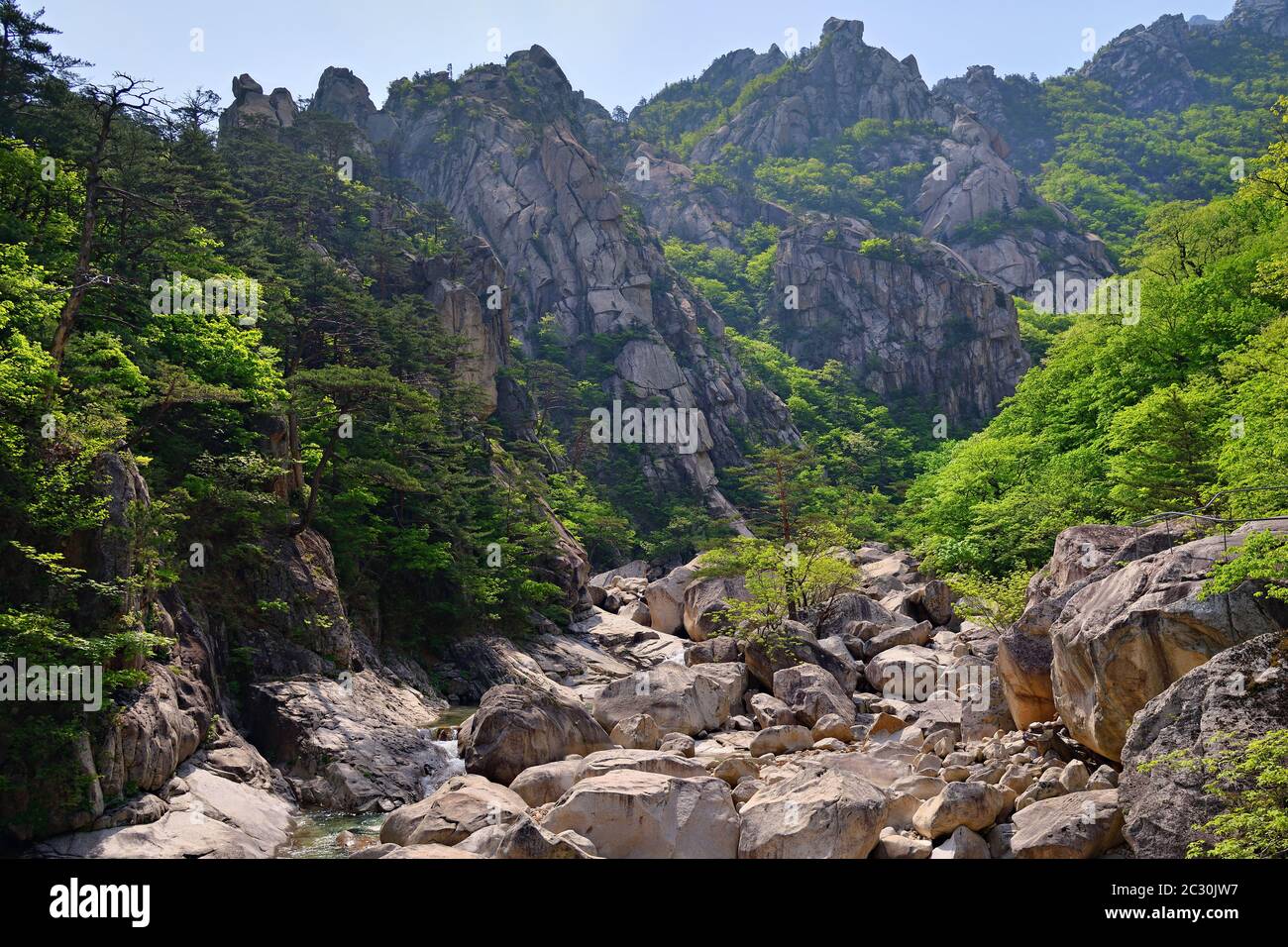 Stream Between Two Rocks Beautiful stream between rocks in hi-res stock photography and images ...