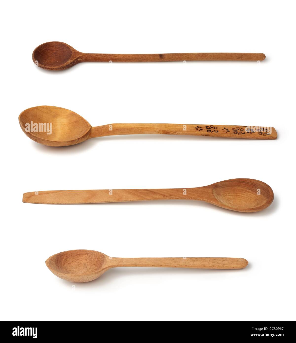 empty wooden old vintage spoons with long handle isolated on white