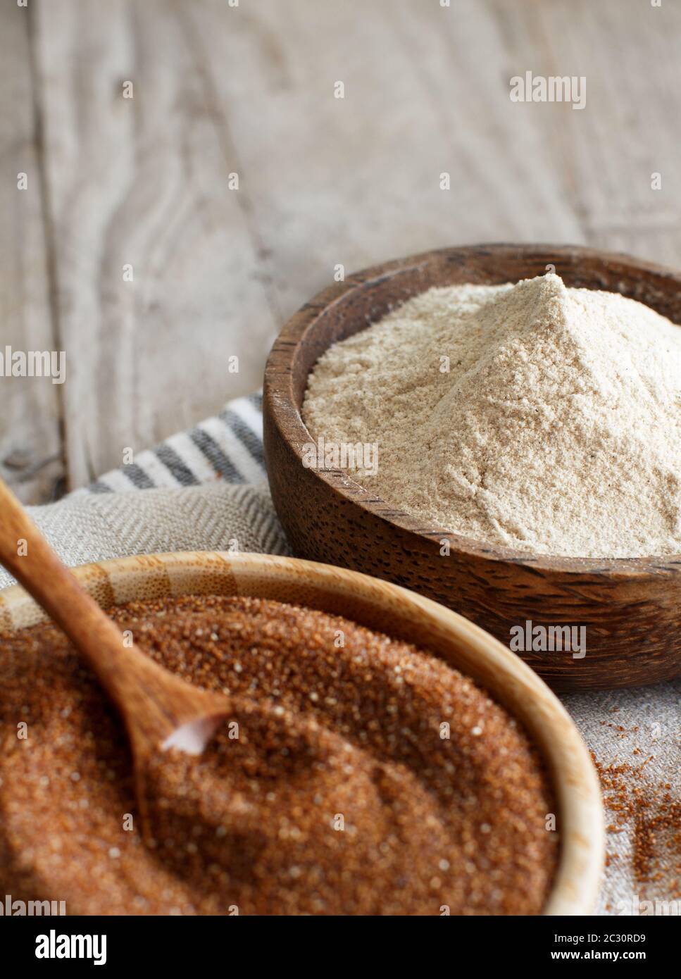 Teff flour and teff grain in bowls close up Stock Photo - Alamy