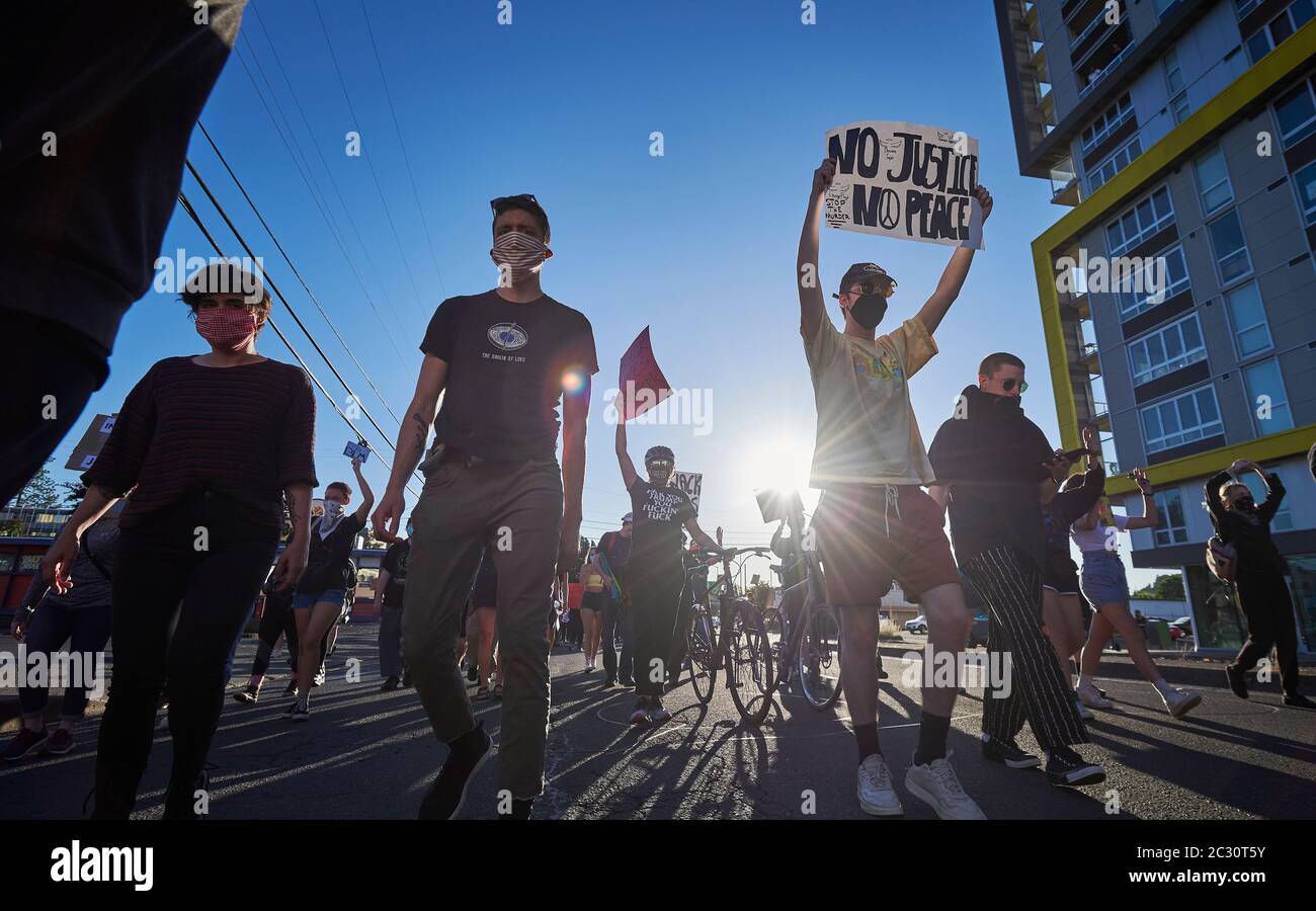 People march in a June 3, 2020, Black Lives Matter protest in Eugene, Oregon. Stock Photo