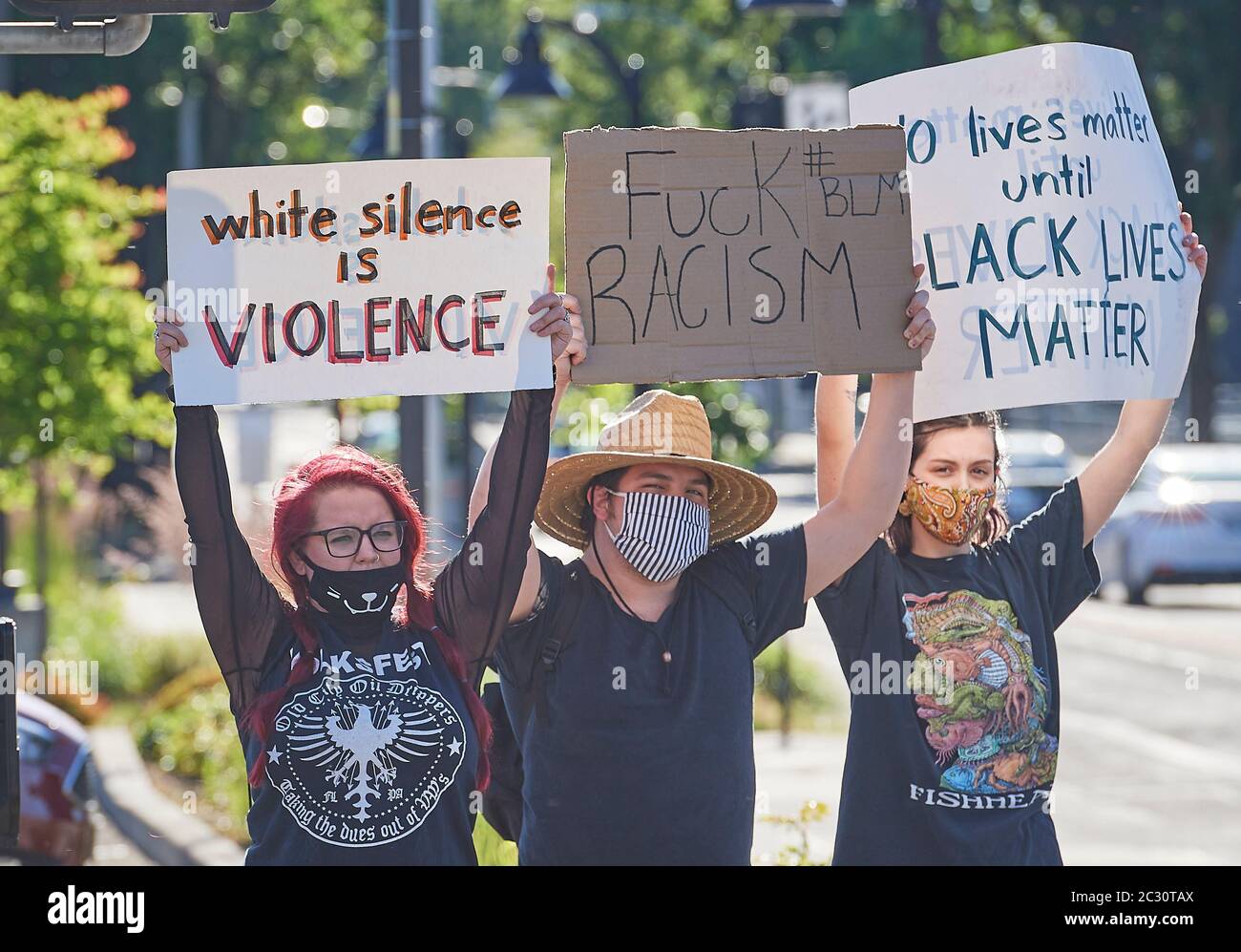 People hold signs at a June 3, 2020, Black Lives Matter protest in Eugene, Oregon. Stock Photo