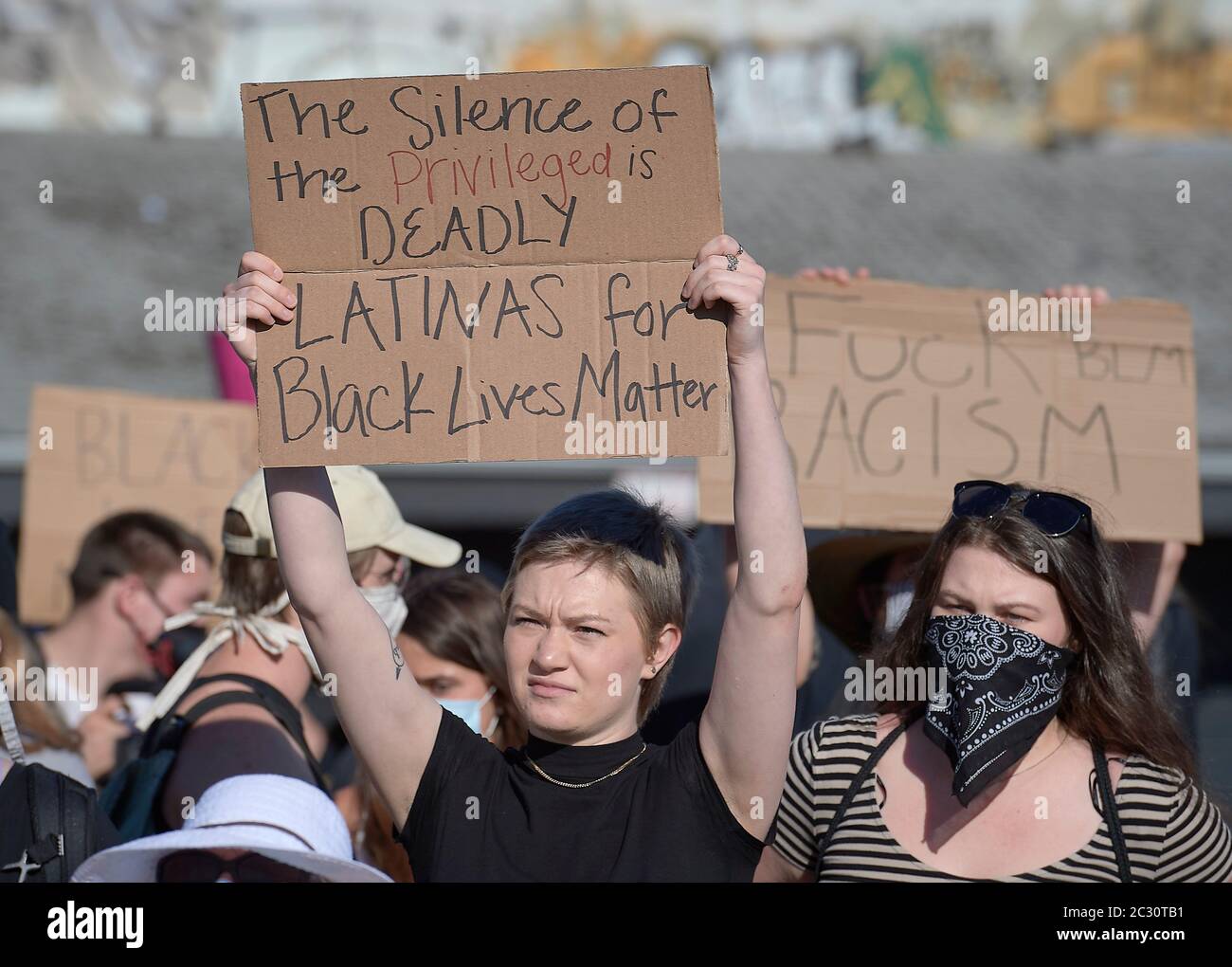 People hold signs at a June 3, 2020, Black Lives Matter protest in Eugene, Oregon. Stock Photo