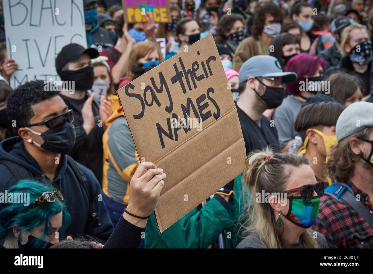 Many carrying signs, people participate in a June 7, 2020, Black Lives Matter protest in Eugene, Oregon. Stock Photo