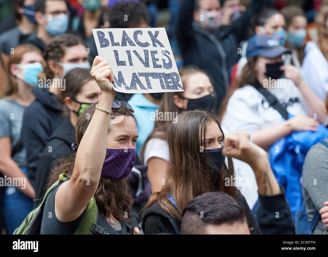 Many carrying signs, people participate in a June 7, 2020, Black Lives Matter protest in Eugene, Oregon. Stock Photo